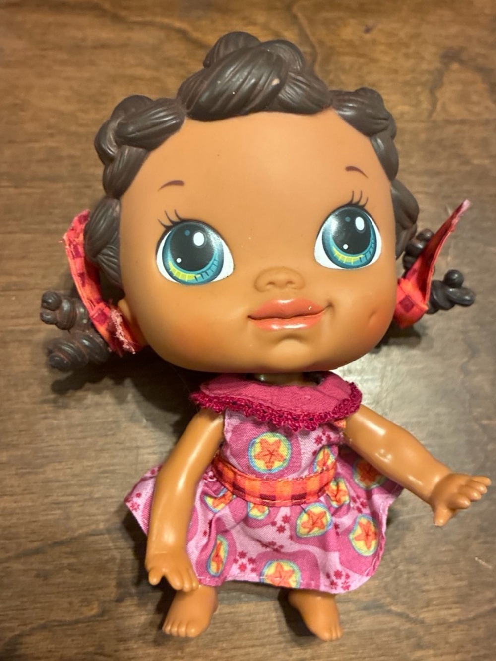 Baby Doll in Pink Patterned Dress - Brown Skin, Blue Eyes